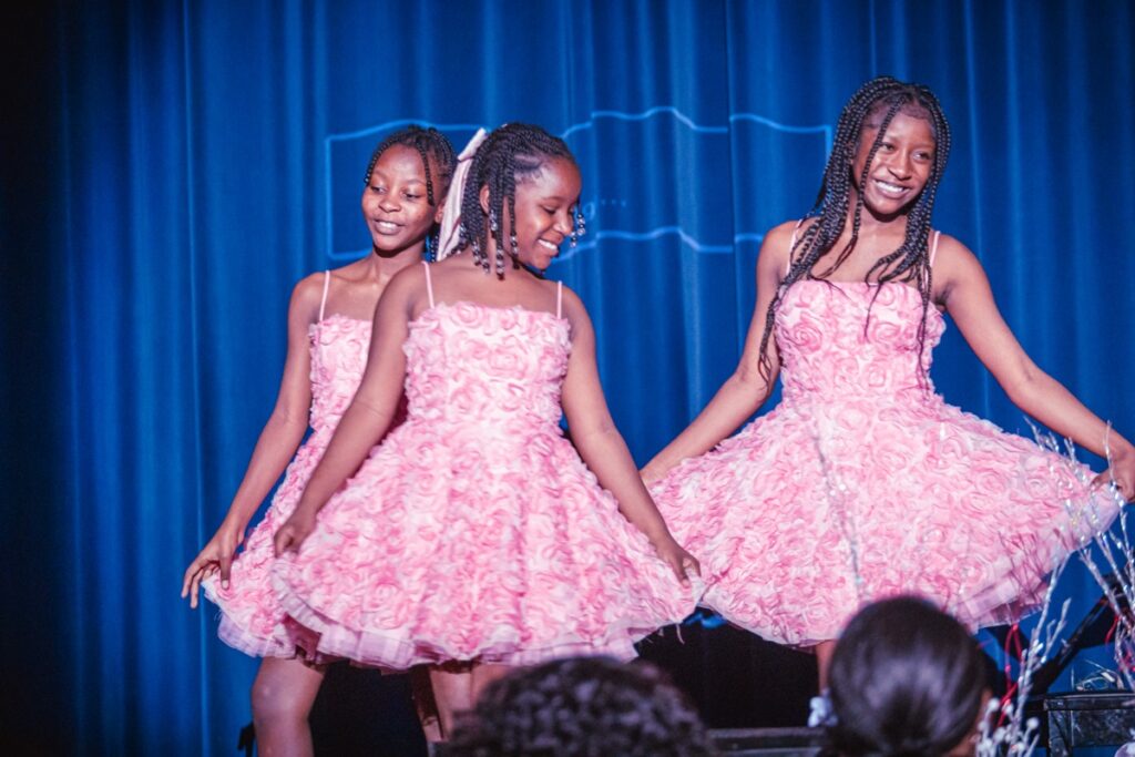 Two young guests in matching pink dresses